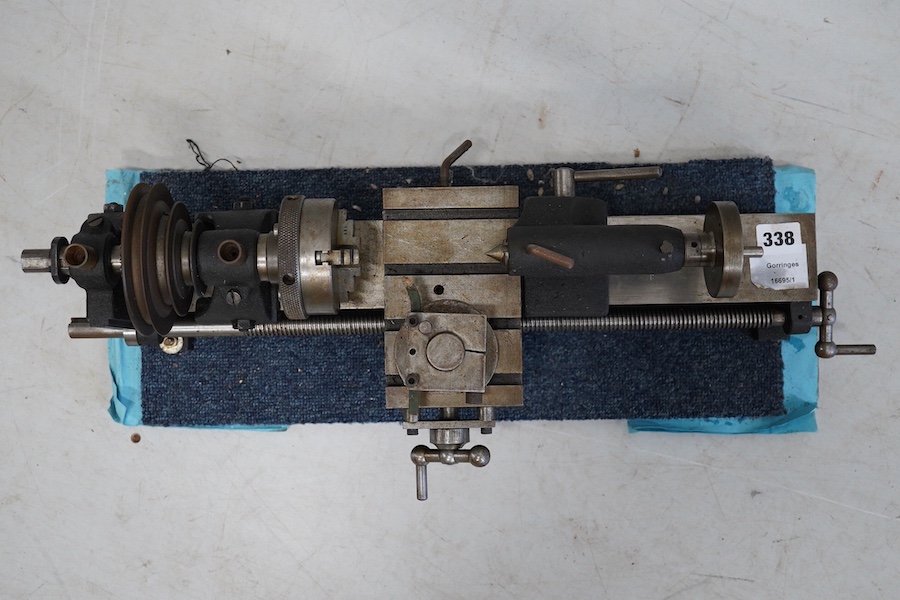 A model engineering workshop lathe, by E.W. Stringer, length 60cm. Condition - fair, some surface rust.